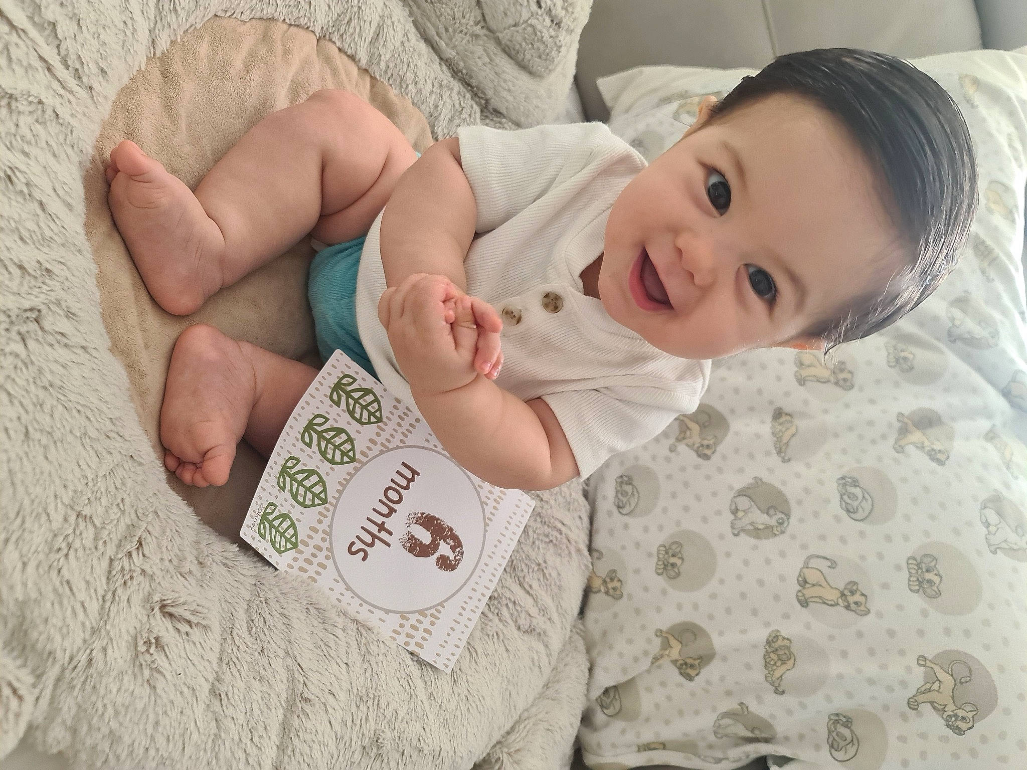 Zaire joined the competition — help win amazing prizes! baby, baby_toddler_clothing, cheek, child, comfort, eye, foot, gesture, happy, head, linens, nail, pattern, person, room, skin, sleeve, smile, textile, thumb