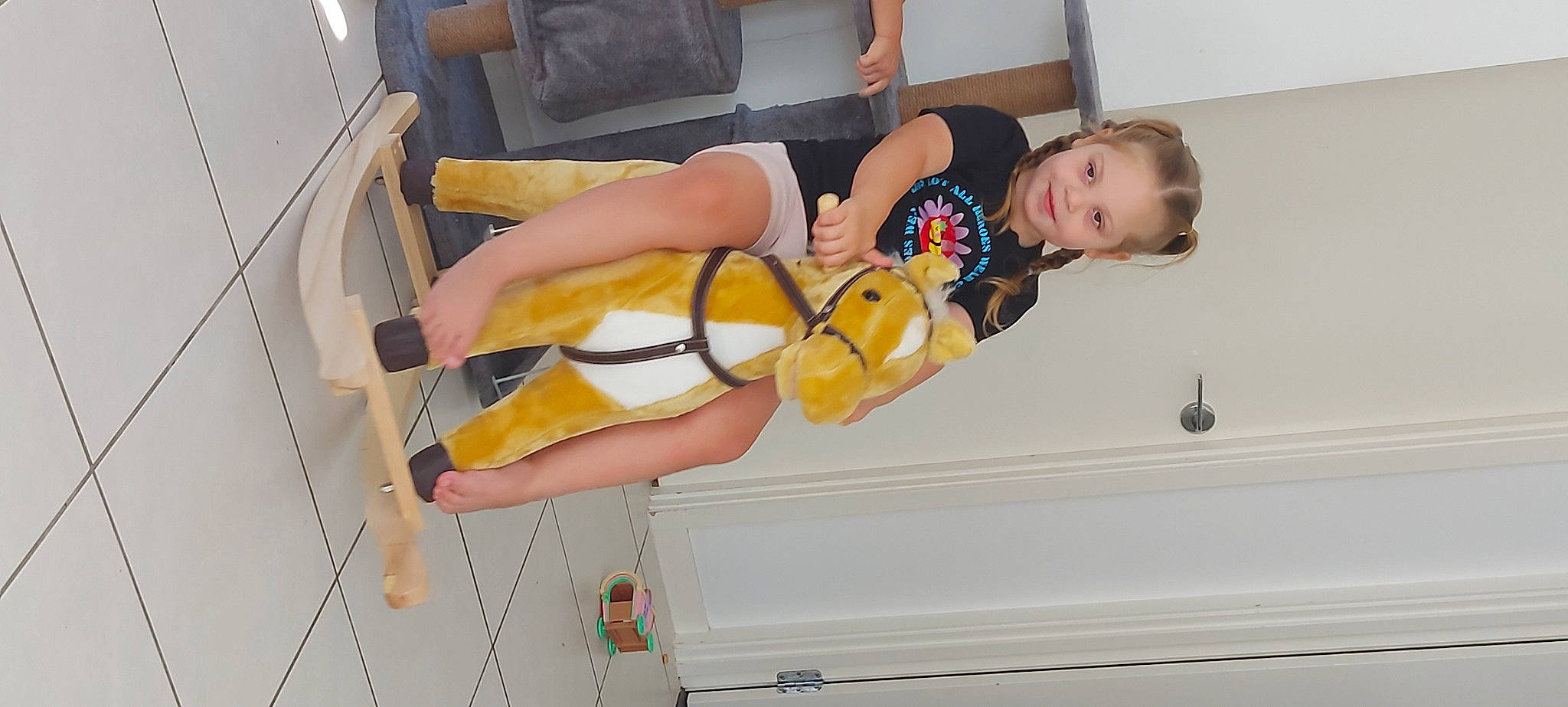 Nya is registered to the contest to win money with this photo: arm, chair, chest, comfort, elbow, eyewear, face, foot, fun, human_leg, joy, knee, leg, person, room, sandal, shorts, smile, thigh, toddler