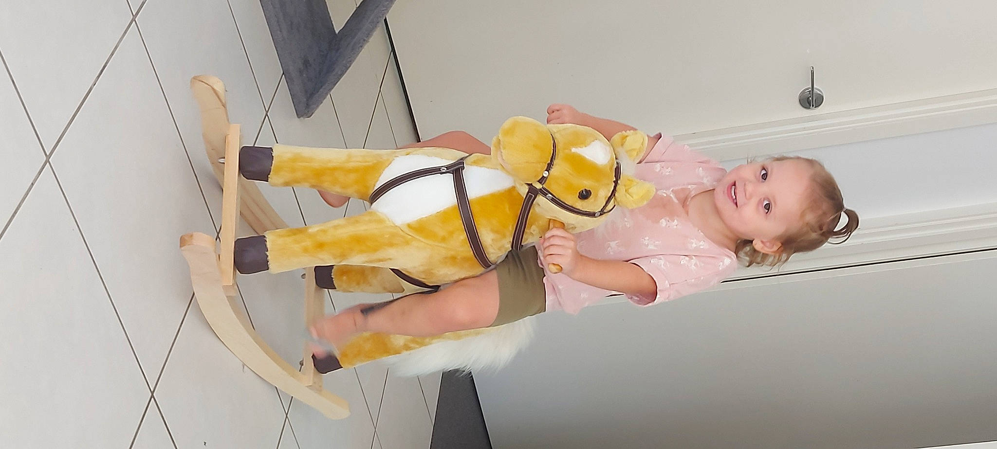 Ava is registered to the contest to win money with this photo: abdomen, art, baby_toddler_clothing, comfort, costume, elbow, foot, fun, happy, human_leg, joy, knee, leg, person, room, sandal, smile, thigh, toddler, wrist