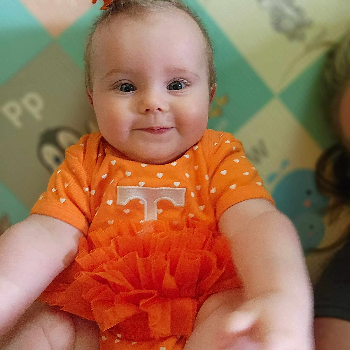 Malaynah is registered to the contest to win money with this photo: accessories, baby, blouse, bodypart, clothing, dress, face, finger, hand, happy, head, jewelry, newborn, pattern, person, photography, portrait, sitting, smile, t_shirt