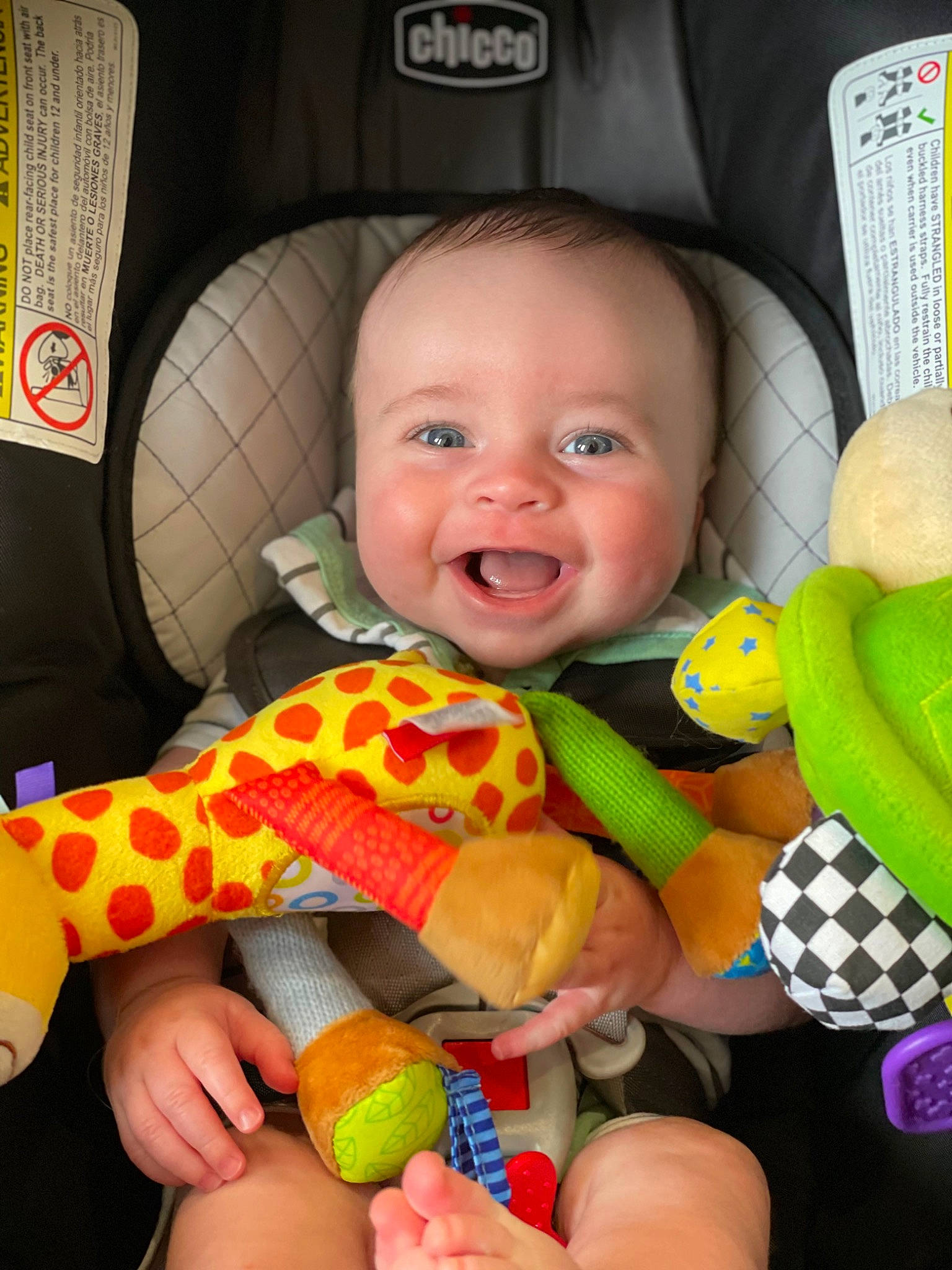 Chandler joined the competition — help win amazing prizes! baby, baby_playing_with_toys, baby_toddler_clothing, cheek, eye, finger, green, hand, happy, infant_bed, iris, mouth, nose, orange, organ, person, product, skin, smile, toddler