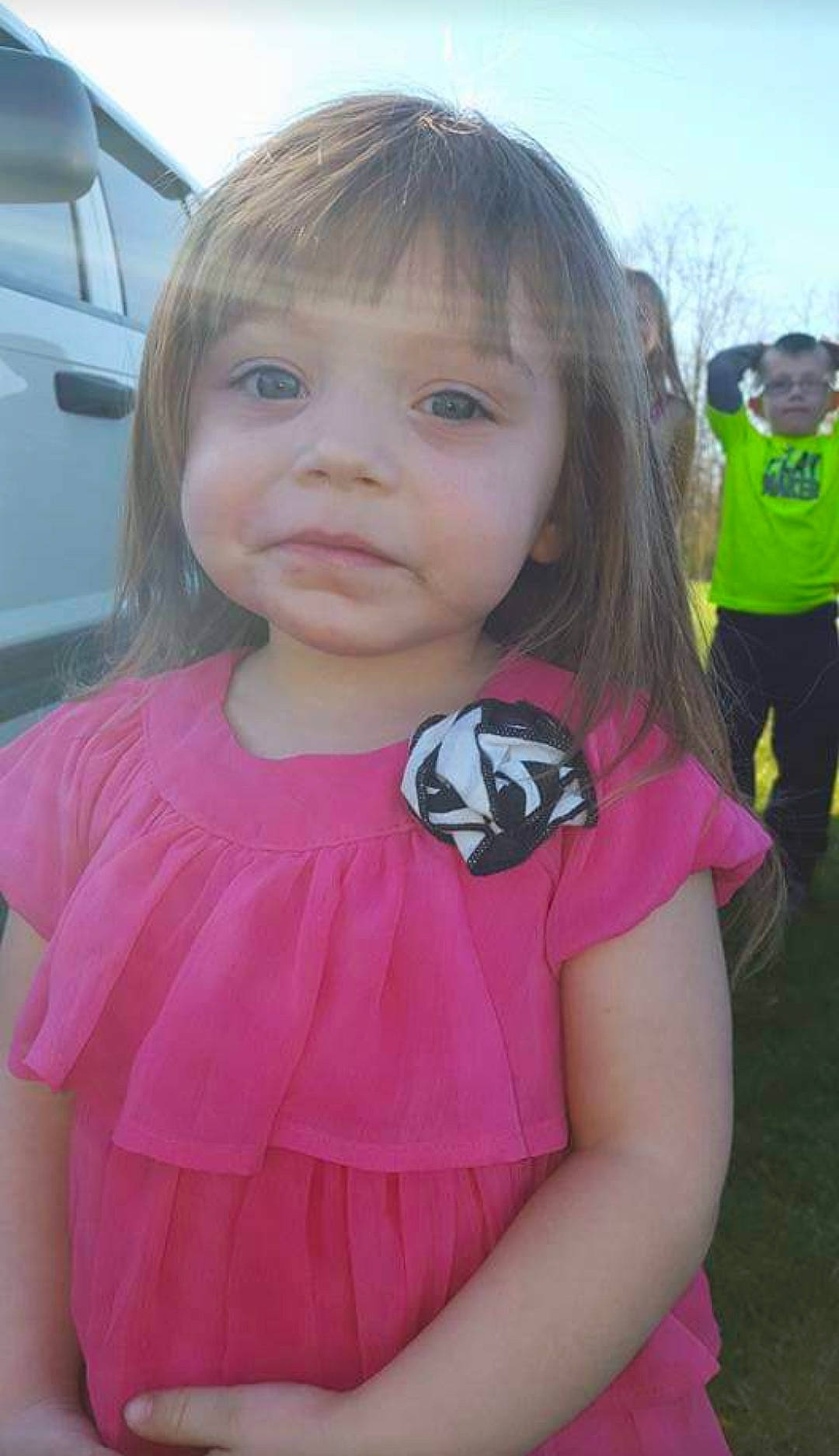 Merella is registered to the contest to win money with this photo: baby_toddler_clothing, bangs, child, cool, eyelash, facial_expression, grass, happy, iris, lip, magenta, person, pink, plant, skin, sky, sleeve, summer, t_shirt, toddler