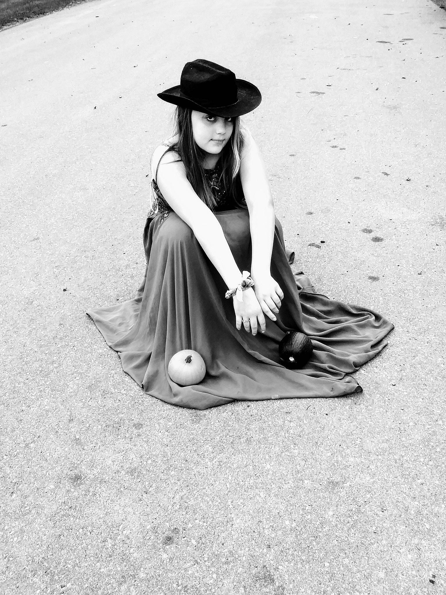 Cynthia is registered to the contest to win money with this photo: black_and_white, eyewear, flash_photography, hat, headgear, headwear, human_leg, knee, leg, monochrome, monochrome_photography, people_in_nature, person, road_surface, sandal, shoe, street_fashion, style, sun_hat, thigh