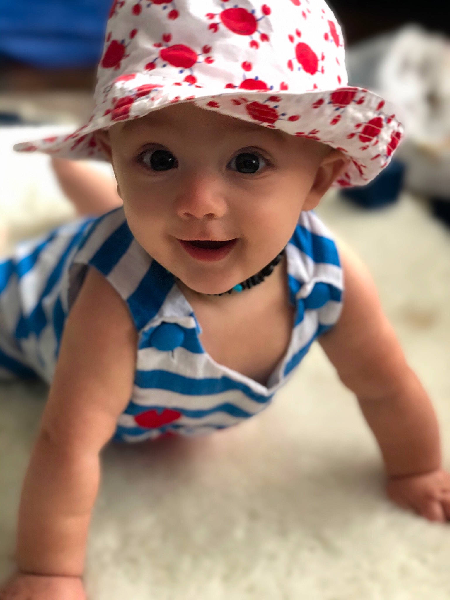 Tanden is registered to the contest to win money with this photo: baby, baby_toddler_clothing, cap, cheek, child, clothing, crawling, fashion_accessory, fun, hat, head, headgear, headwear, lip, person, play, skin, smile, summer, sun_hat