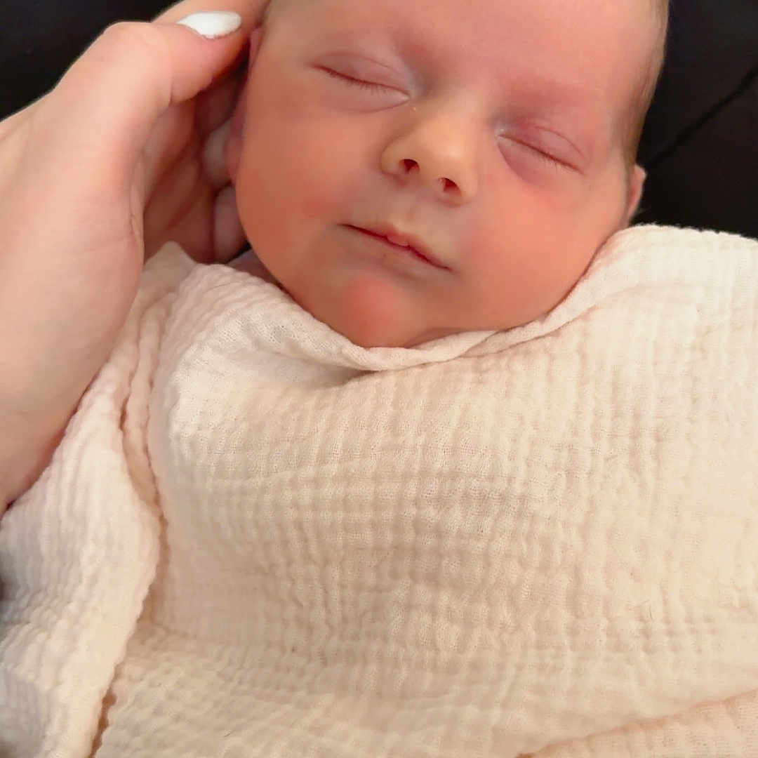 Katharina is registered to the contest to win money with this photo: baby, newborn, sleeping, blanket, hand, soft, cradle, peaceful, infant, face, skin, nails, toddler, portrait, closeup, resting, cute, child, wrapped, comfort