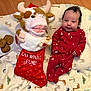Jameson is registered to the contest to win money with this photo: animal_print, baby, blanket, child, christmas, christmas_stocking, cookies, cozy, cute, festive, floor, holiday, infant, milk, milk_glass, plush_toy, red_onesie, smiling, snack, toy