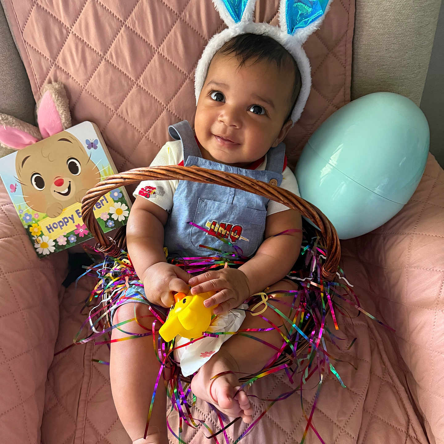 Lennox joined the competition — help win amazing prizes! baby, bunny_ears, basket, ribbons, yellow_duck, large_egg, book, pink_chair, quilted_texture, smiling, child, indoor, cute, festive, easter, toy, happy, person, colorful, decor