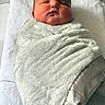 June is registered to the contest to win money with this photo: newborn, baby, blanket, swaddled, sleeping, infant, soft, cozy, wrapped, cute, child, face, resting, indoors, closeup, person, towel, head, skin, peaceful