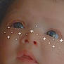 Nala is registered to the contest to win money with this photo: baby, face, close_up, child, cute, filter, stars, dots, skin, expression, innocent, portrait, young, soft_light, cheeks, eyes, nose, mouth, background, infant