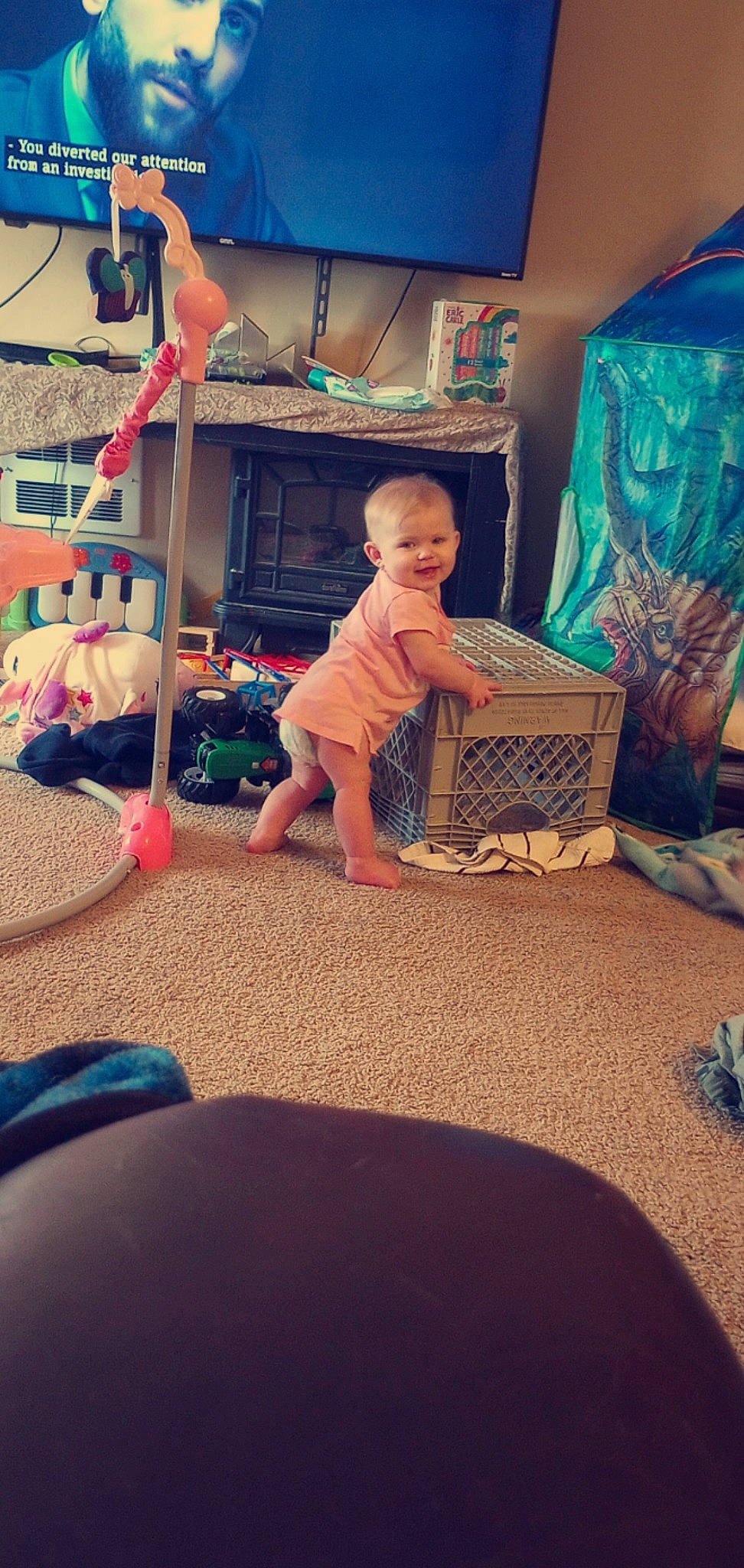 Addilynn joined the competition — help win amazing prizes! baby, baby_toddler_clothing, blue, carpet, child, comfort, floor, flooring, fun, happy, home, joy, leisure, living_room, person, play, room, shelf, sitting, t_shirt