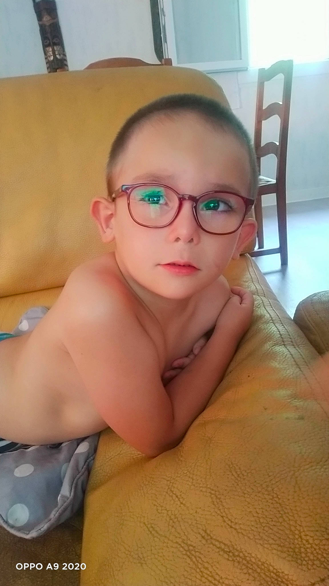 Ethan participe au concours pour gagner de l'argent avec cette photo : barechested, chair, cheek, chest, comfort, ear, eyebrow, eyewear, finger, glasses, jaw, mouth, neck, nose, person, shoulder, sunglasses, thumb, toddler, trunk