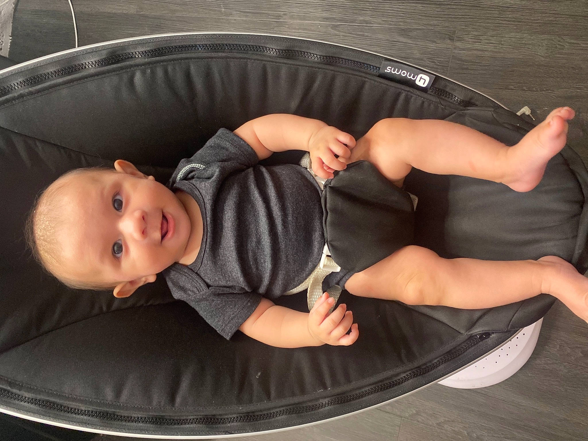 Joaquin is registered to the contest to win money with this photo: auto_part, automotive_exterior, automotive_tire, automotive_wheel_system, baby, baby_products, baby_toddler_clothing, bag, bumper, child, comfort, facial_expression, finger, fun, grass, hand, leg, leisure, person, sitting