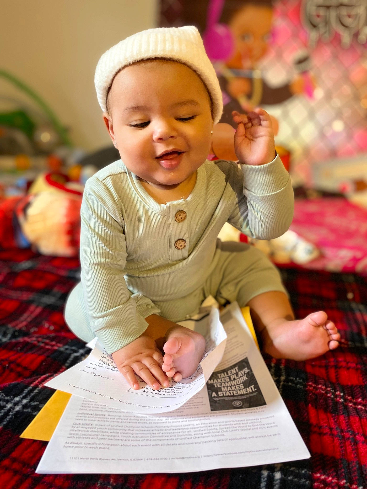 Ace On is registered to the contest to win money with this photo: baby, baby_toddler_clothing, cheek, child, design, event, finger, fun, hand, happy, person, pink, plaid, publication, sitting, skin, sleeve, smile, snapshot, tartan