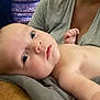 Montgomery is registered to the contest to win money with this photo: baby, infant, child, person, face, skin, hand, adult, clothing, blanket, indoor, portrait, laying, curious, soft, resting, closeup, head, expression, room