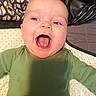 Montgomery joined the competition — help win amazing prizes! baby, infant, child, portrait, face, smiling, open_mouth, lying_down, green_clothing, bed, bedding, patterned_fabric, close_up, indoors, cozy, happy, eyes, tongue, head, photography