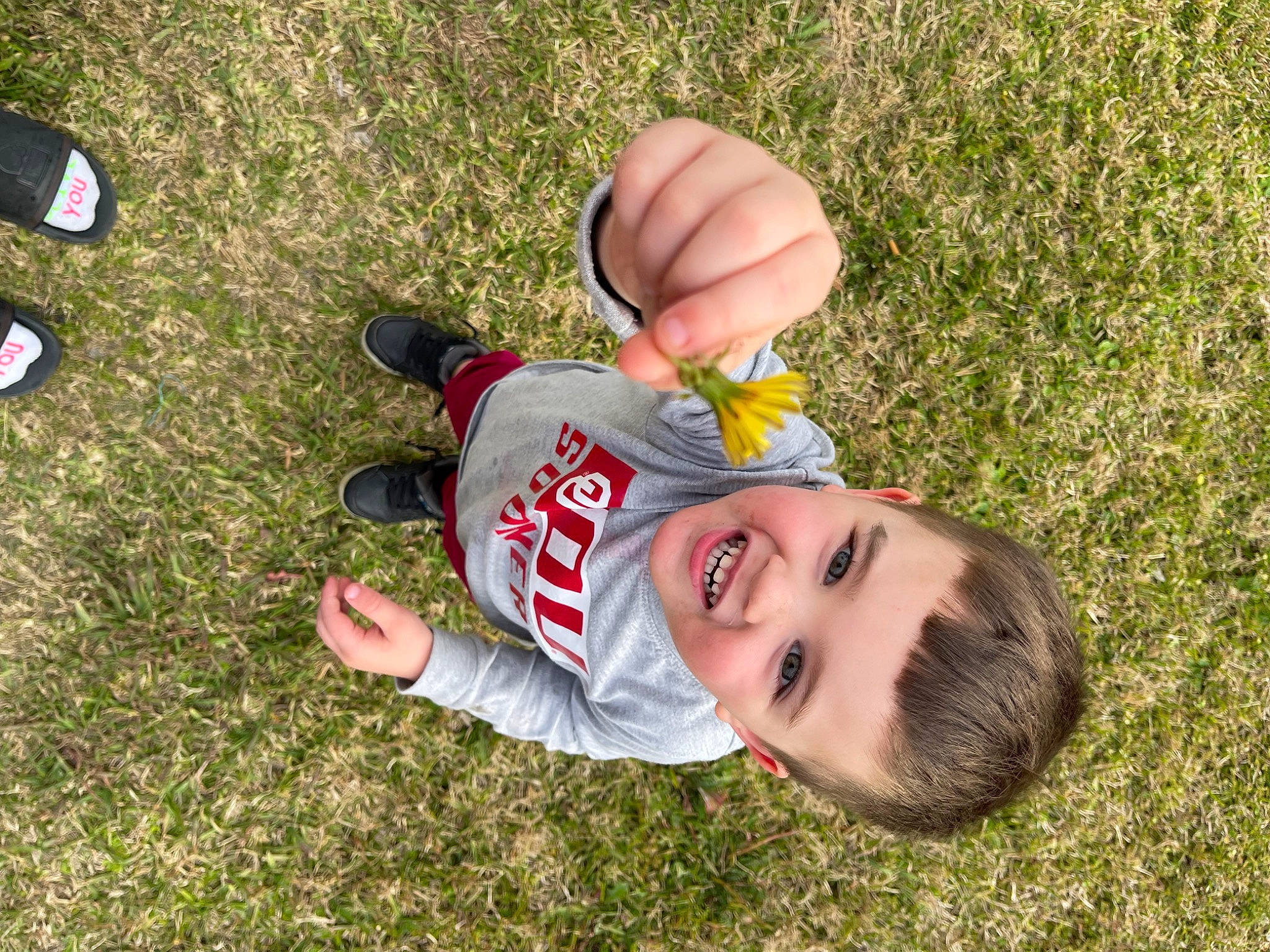 Gunnar is registered to the contest to win money with this photo: baby_laughing, child, foot, fun, grass, grass_family, grassland, happy, hat, joy, lawn, leisure, meadow, people_in_nature, person, play, recreation, sandal, smile, soil