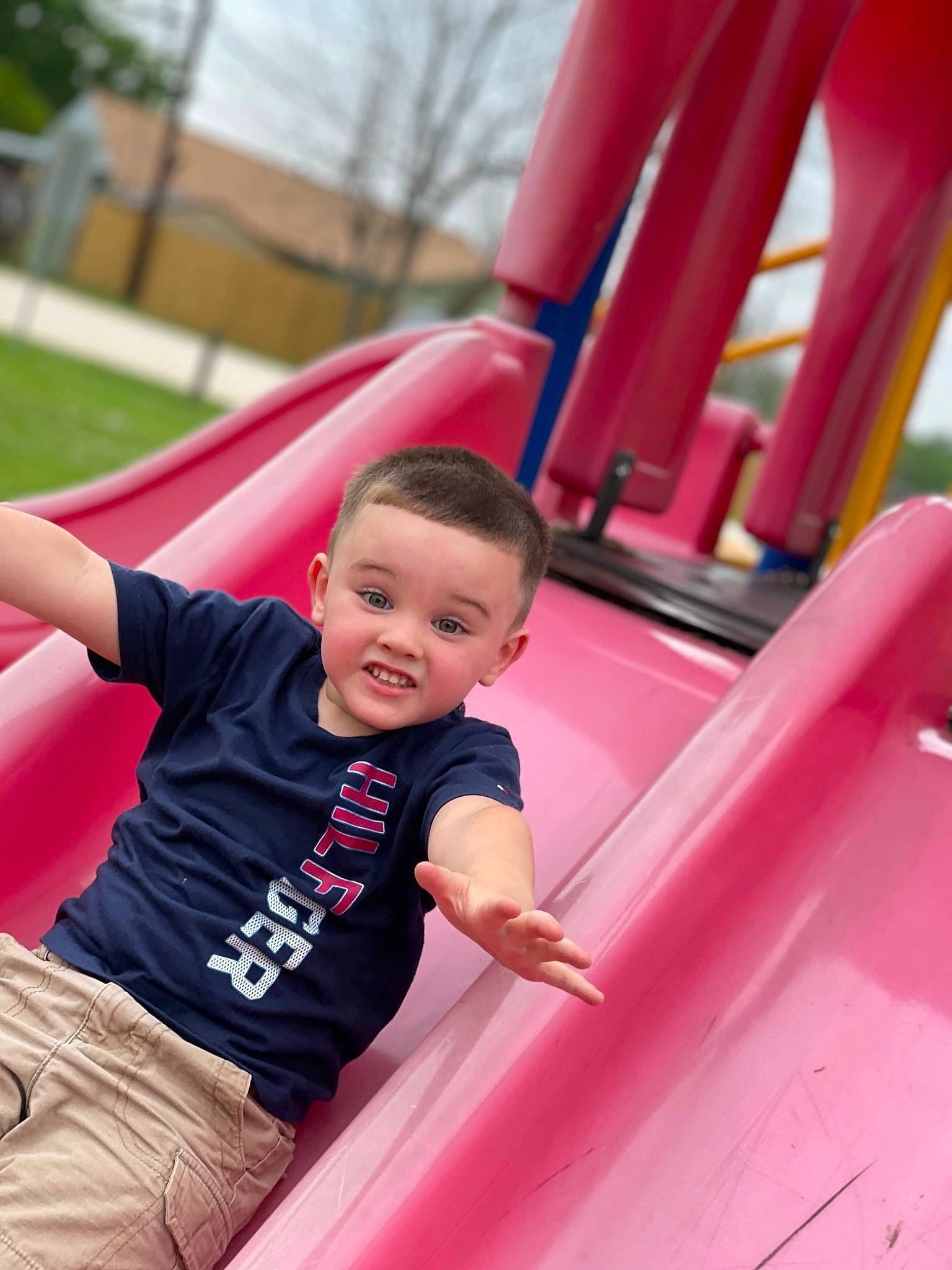 Gunnar is registered to the contest to win money with this photo: child, chute, fun, happy, leisure, magenta, outdoor_play_equipment, people, person, pink, playground, playground_slide, product, public_space, recreation, red, shorts, smile, summer, t_shirt