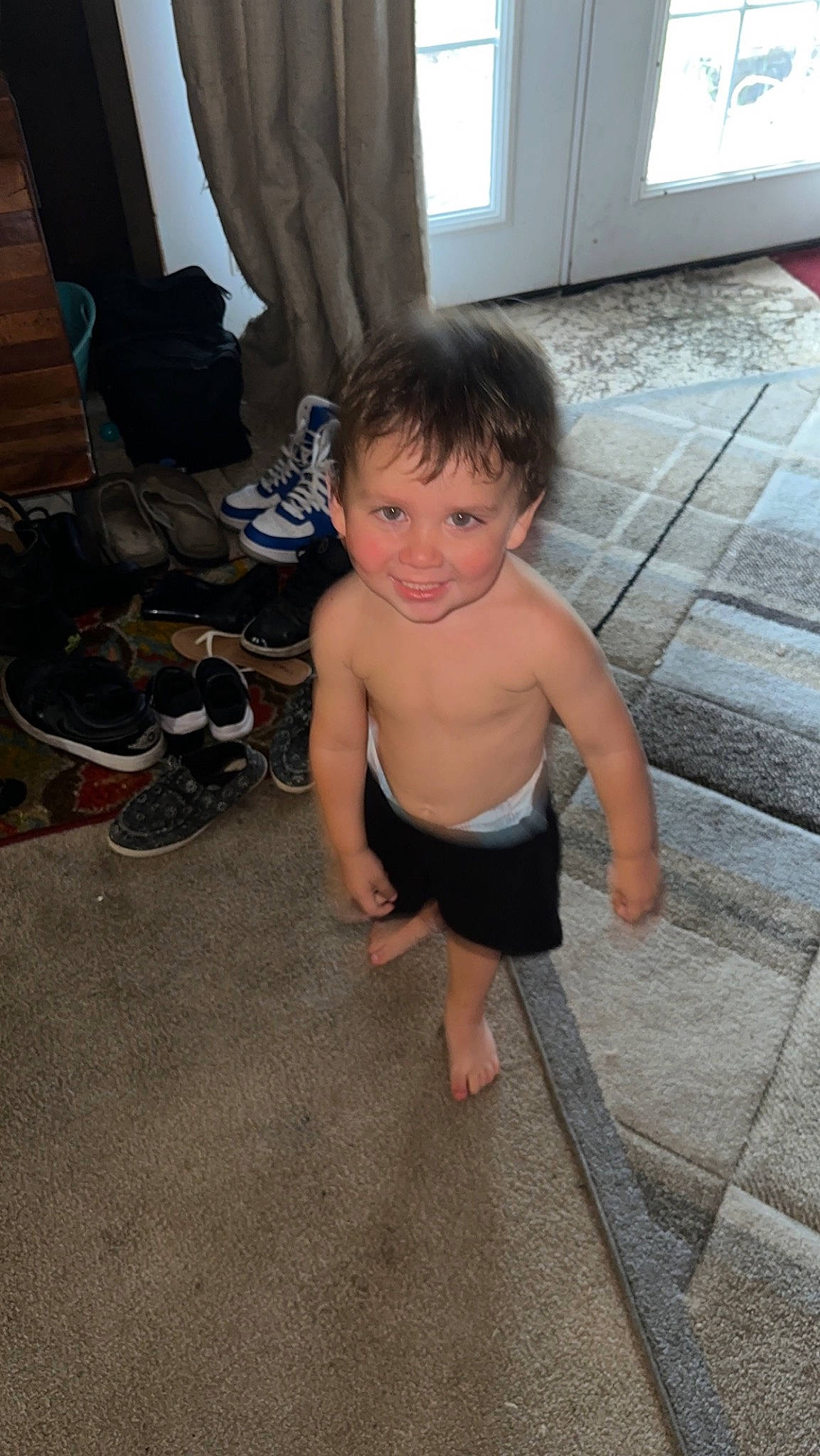 Emmet joined the competition — help win amazing prizes! baby, barefoot, chest, child, finger, floor, flooring, foot, fun, hardwood, human_body, human_leg, joy, leg, person, sitting, smile, thigh, thumb, toddler