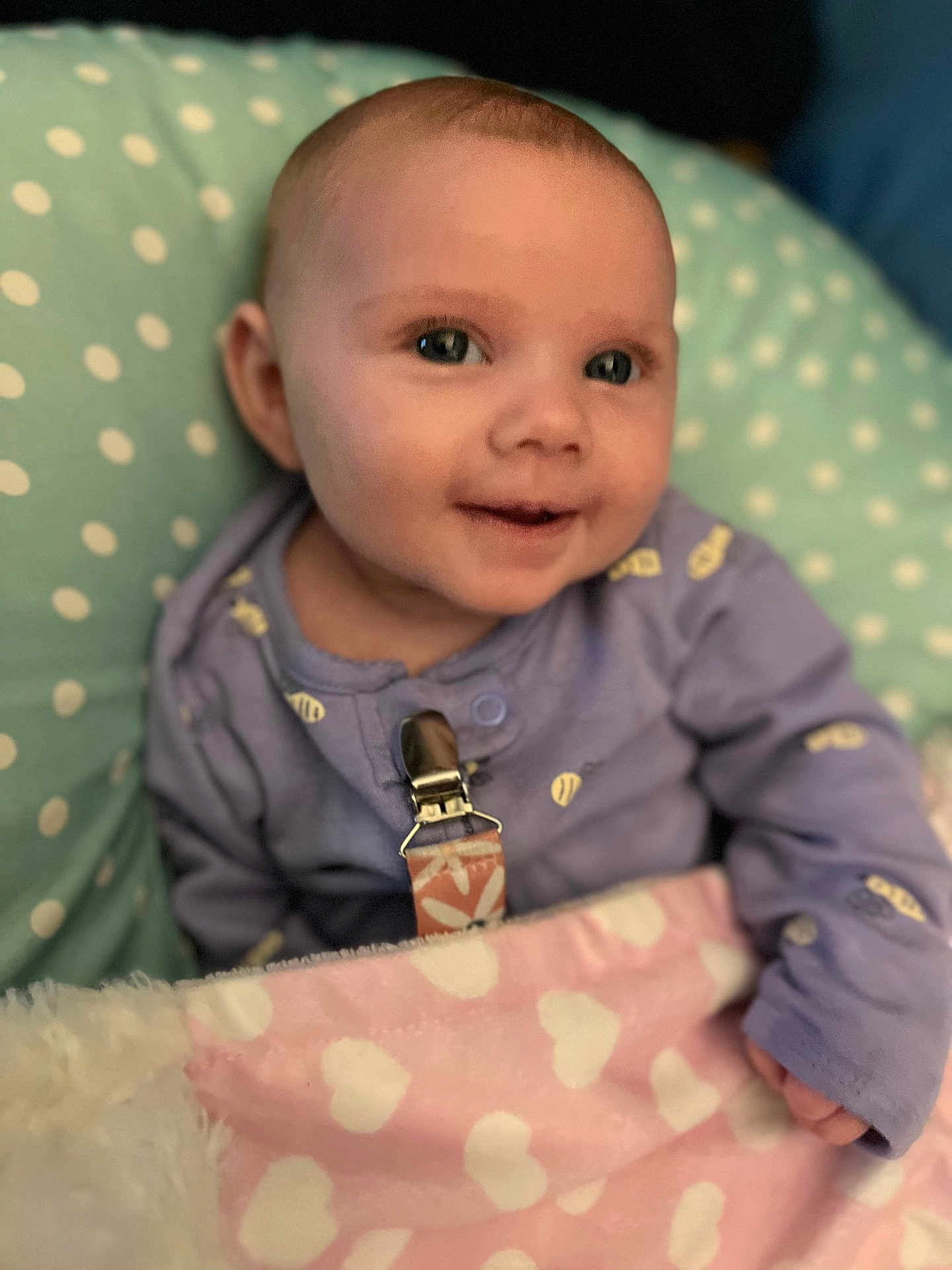 Everlynn joined the competition — help win amazing prizes! baby, smiling, blanket, heart_pattern, onesie, pacifier_clip, cushion, polka_dots, infant, child, face, portrait, cute, soft, comfort, resting, indoors, warm, young, happy