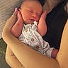 Brenley is registered to the contest to win money with this photo: arms, baby, blanket, closeup, clothing, comfort, couch, fabric, floral, hand, indoor, infant, nail_polish, newborn, person, ring, skin, sleeping, tattoo, watch