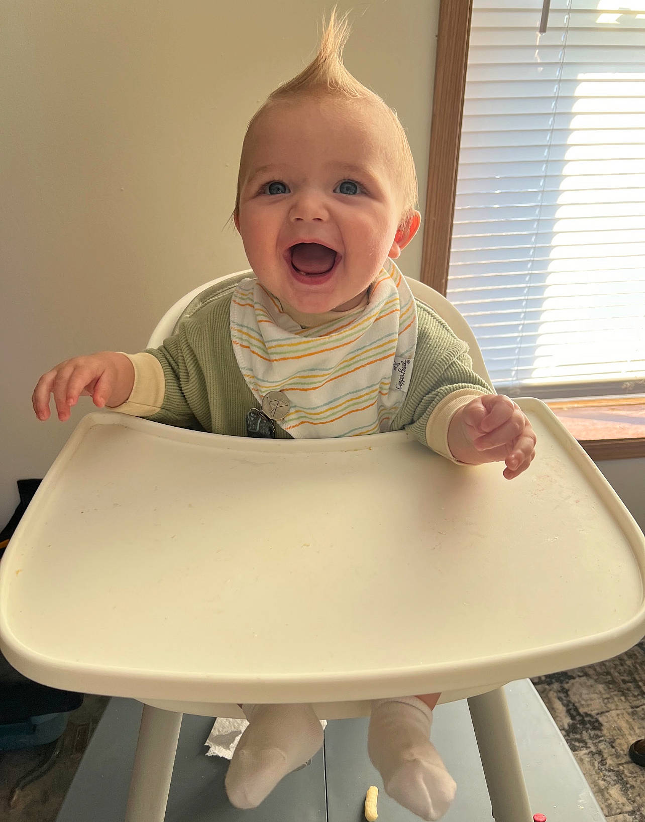 Kooper joined the competition — help win amazing prizes! baby, baby_laughing, baby_products, baby_toddler_clothing, chair, child, comfort, finger, hairstyle, happy, human_body, person, product, sitting, sleeve, smile, t_shirt, table, toddler, window