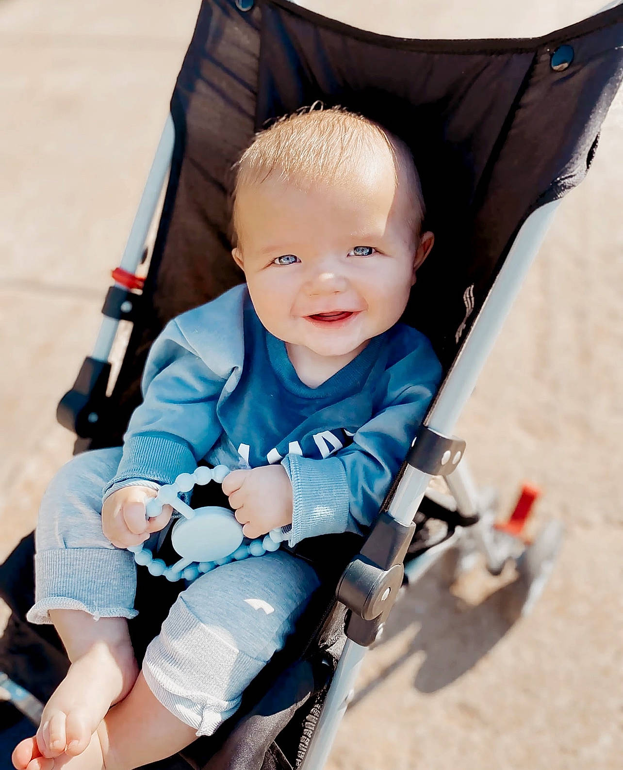 Kooper joined the competition — help win amazing prizes! auto_part, baby, baby_carriage, baby_products, baby_toddler_clothing, child, comfort, electric_blue, facial_expression, fun, happy, human_body, joy, knee, person, sitting, skin, sleeve, smile, toddler
