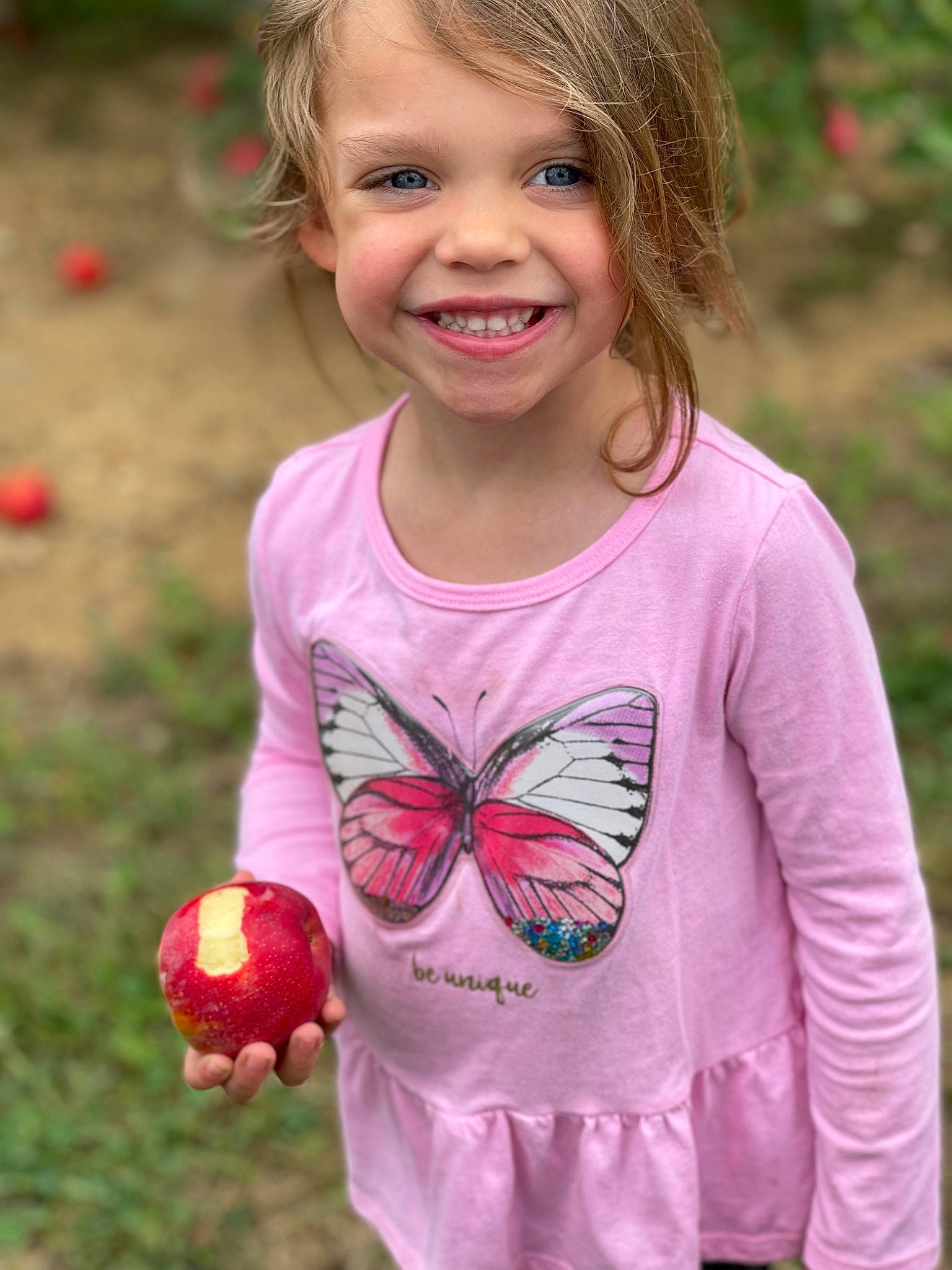 Larkin joined the competition — help win amazing prizes! arthropod, baby_toddler_clothing, botany, facial_expression, grass, green, happy, insect, joy, leaf, moths_and_butterflies, organ, people, people_in_nature, person, pink, plant, pollinator, sleeve, smile