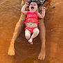 Scarlett joined the competition — help win amazing prizes! baby, child, swimsuit, water, adult, tattoo, smile, laughing, summer, floating, support, tropical_print, legs, feet, skin, outdoor, fun, happy, parent, play