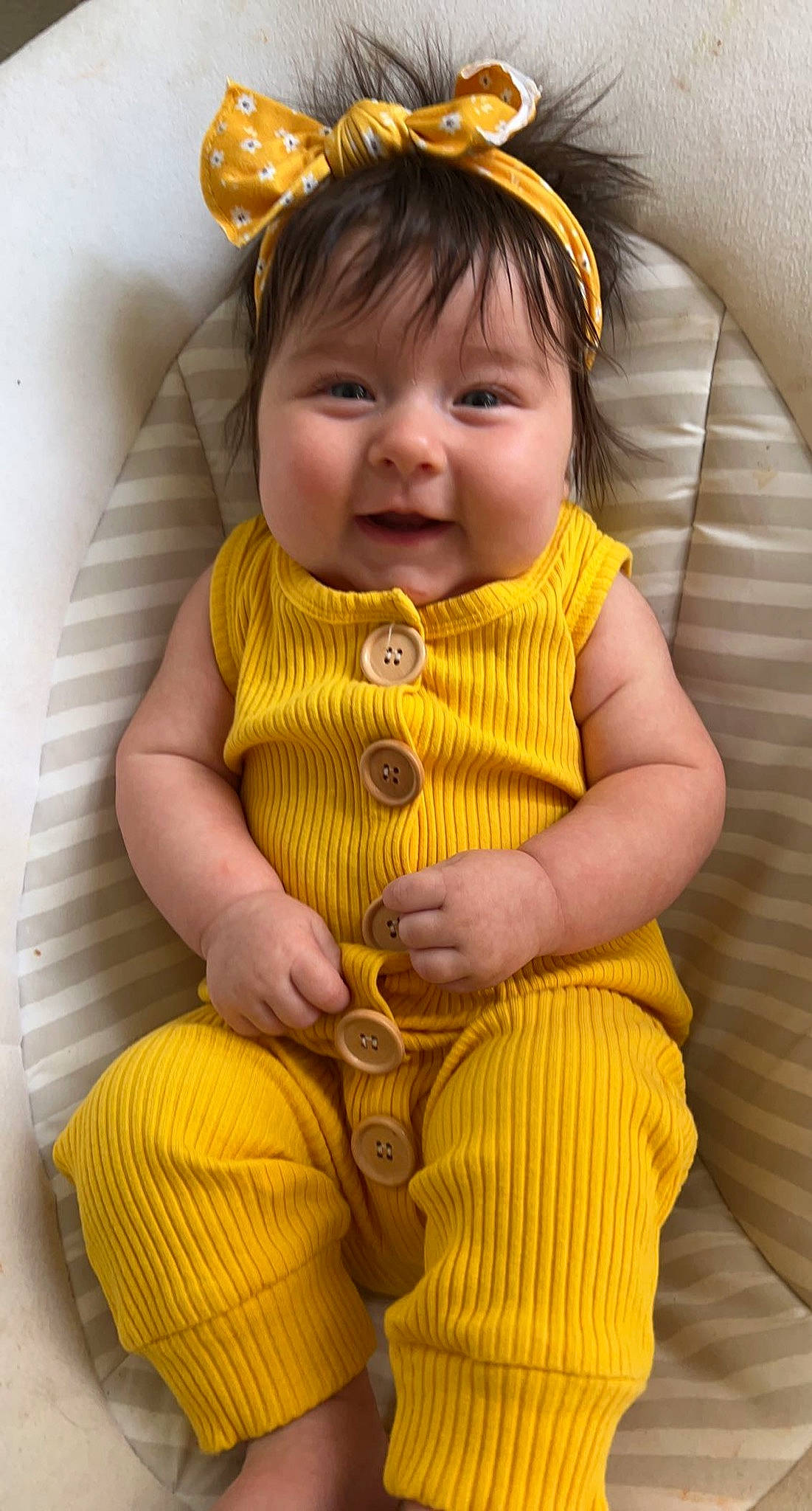 Milliana is registered to the contest to win money with this photo: baby_toddler_clothing, cheek, chin, comfort, dress, eye, face, finger, hand, happy, head, human_body, iris, organ, person, pink, skin, sleeve, smile, textile