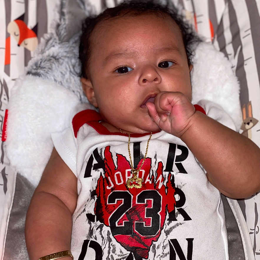 Clifford Iii is registered to the contest to win money with this photo: accessories, baby, bodypart, clothing, couch, cushion, face, finger, furniture, hand, head, homedecor, jewelry, necklace, newborn, person, photography, portrait, sleeping, t_shirt