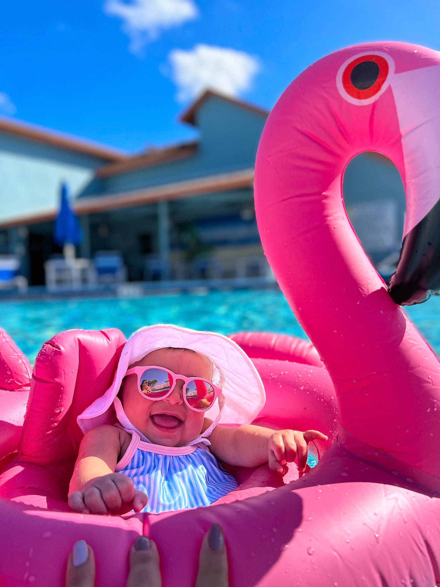 Angelica is registered to the contest to win money with this photo: aqua, blue, cloud, daytime, electric_blue, event, eyewear, fun, goggles, happy, headwear, inflatable, leisure, magenta, person, pink, recreation, red, sky, smile