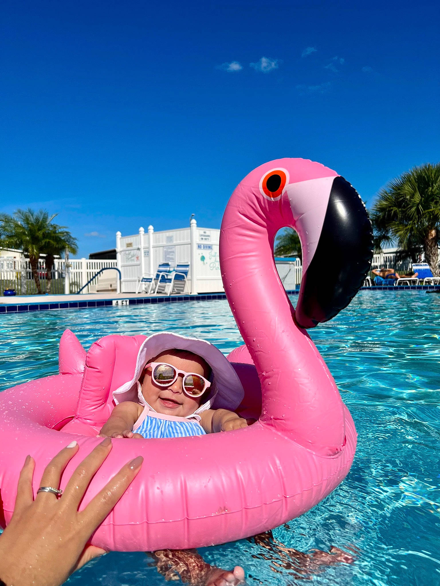 Angelica is registered to the contest to win money with this photo: _geese_and_swans, aqua, azure, blue, boats_and_boating_equipment_and_supplies, ducks, eyewear, fun, goggles, headwear, inflatable, lake, leisure, outdoor_recreation, person, personal_protective_equipment, pink, recreation, sky, travel