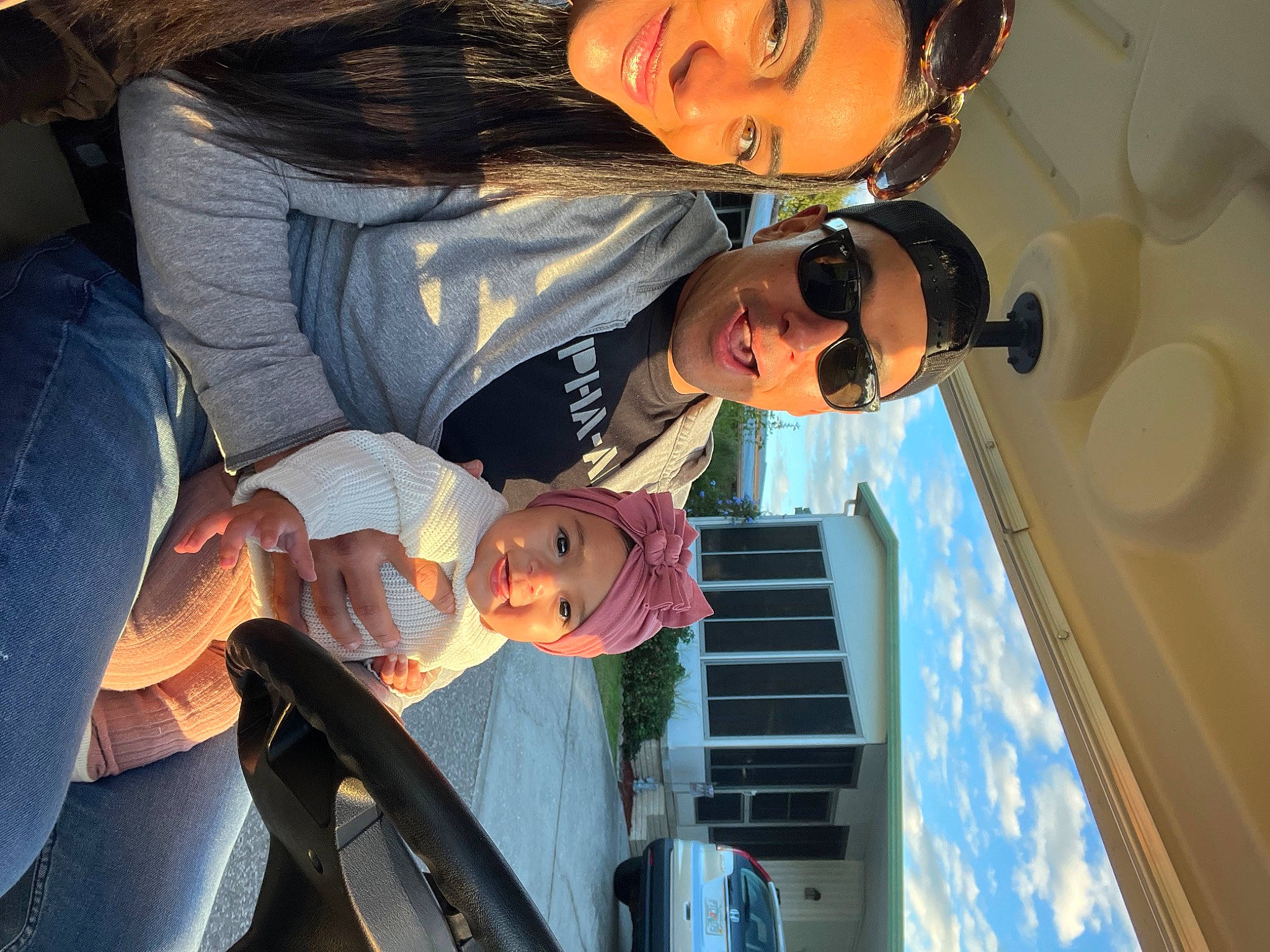 Angelica is registered to the contest to win money with this photo: automotive_lighting, blue, car, clothing, cool, eye, eyewear, flash_photography, fun, happy, headwear, interaction, joy, light, mouth, organ, person, photograph, sky, smile