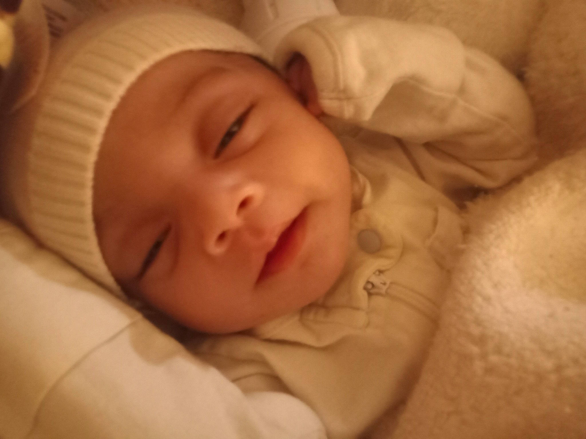 Zemirah is registered to the contest to win money with this photo: baby, baby_toddler_clothing, bedtime, cheek, child, comfort, eye, eyebrow, face, grass, happy, hat, head, headwear, iris, linens, lip, nose, person, skin