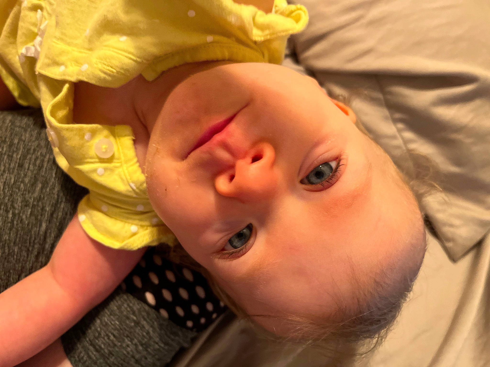 Renesmae is registered to the contest to win money with this photo: baby, baby_toddler_clothing, cheek, child, close_up, ear, eye, eyebrow, eyelash, fun, grass, happy, head, iris, lip, mouth, neck, nose, person, skin