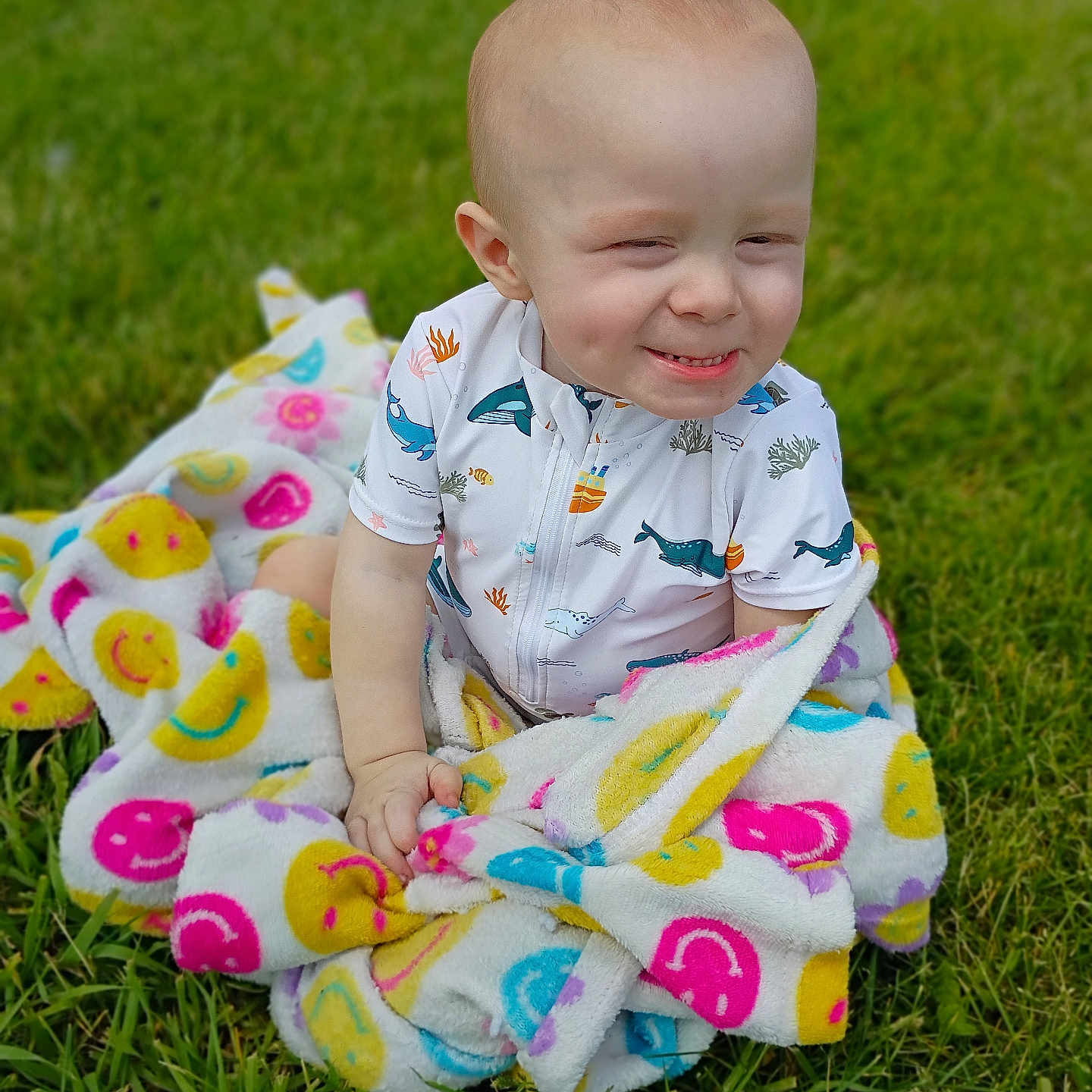 Randy joined the competition — help win amazing prizes! toddler, child, blanket, smiling, grass, outdoor, cute, baby, happy, colorful, playful, nature, portrait, sitting, fun, expression, clothing, warm, young, daylight