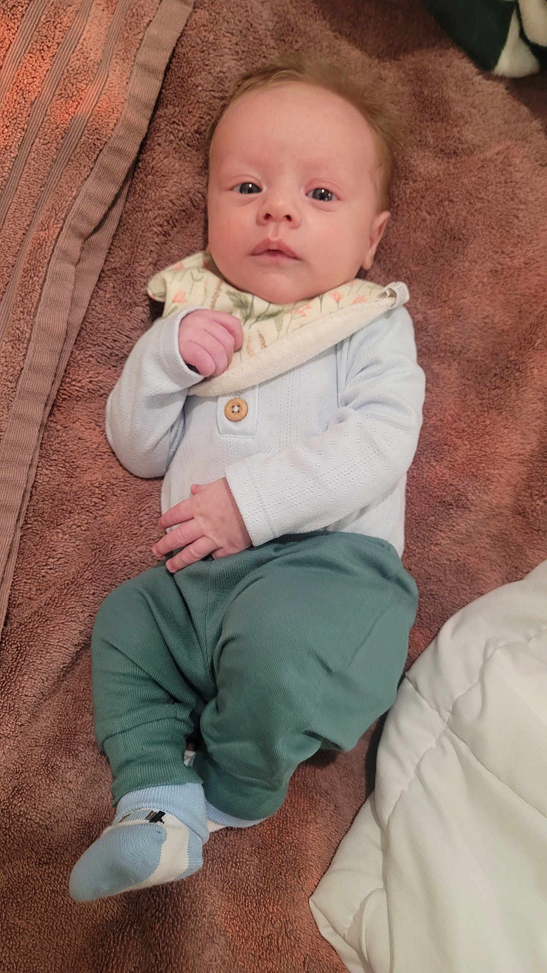 Austin joined the competition — help win amazing prizes! baby, infant, child, towel, clothing, bib, pants, sock, face, hand, lying_down, cute, soft_texture, indoor, portrait, newborn, looking_at_camera, cozy, small, skin