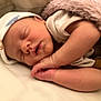 Austin is registered to the contest to win money with this photo: baby, sleeping, newborn, blanket, hat, onesie, infant, cute, peaceful, resting, soft, cozy, skin, hand, face, bed, sleep, portrait, child, indoors