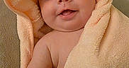 Olivia is registered to the contest to win money with this photo: arm, baby, bath, child, closeup, cozy, cute, eyes, face, happy, hood, indoors, infant, peach, portrait, skin, smile, soft, towel, wrapped