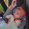Olivia joined the competition — help win amazing prizes! baby, infant, car_seat, pink_headband, plush_toy, blanket, child, outdoor, toy, seat_belt, cute, soft_toy, gaze, headwear, child_safety, car, infant_clothing, baby_girl, closeup, daylight