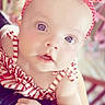 baby, background, blue_eyes, child, closeup, clothing, cute, expression, face, hand, headband, indoors, infant, person, polka_dot, portrait, skin, soft_lighting, striped_clothing, young