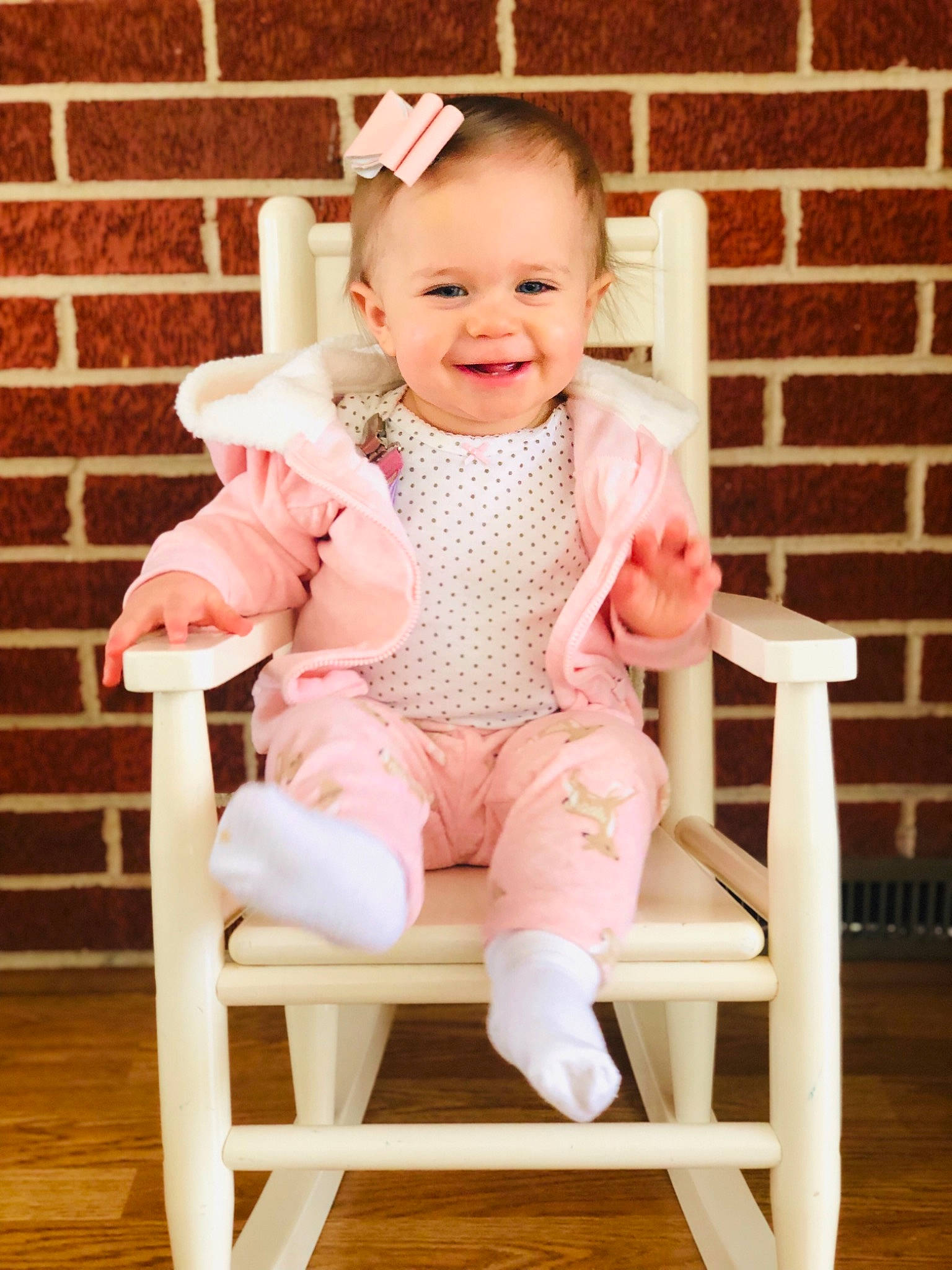 Tinsleigh is registered to the contest to win money with this photo: chair, child, furniture, girl, infant, joy, outerwear, pattern, person, pink, product, sitting, textile, toddler