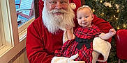 Meadow joined the competition — help win amazing prizes! baby, beard, celebration, chair, child, christmas_tree, decoration, festive, glasses, happy, holiday, indoor, lights, person, plaid_dress, red_clothing, santa_claus, seasonal, smile, window
