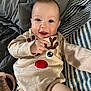 Meadow joined the competition — help win amazing prizes! baby, baby_bottle, blanket, bottle, child, clothing, cute, fabric, happy, indoor, infant, lying_down, onesie, playful, portrait, reindeer_design, smiling, soft, warm, young