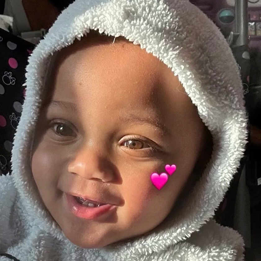 Nova Lynn joined the competition — help win amazing prizes! toddler, child, hooded_clothing, smiling, face, pink_heart_emoji, sunlight, indoor, photography, cute_outfit, cat_design, portrait, happy, baby, furniture, background_photos, music_overlay, cozy, warm_light, expression