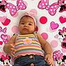 baby, infant, child, polka_dot, headband, flower, striped_top, denim_skirt, minnie_mouse, pink_hearts, cartoon, cute, portrait, colorful, playful, smiling, clothing, background, pattern, happy