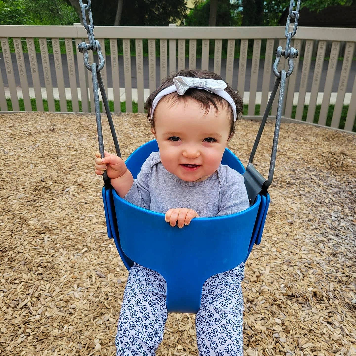 Leilanni joined the competition — help win amazing prizes! baby, baby_toddler_clothing, electric_blue, eye, face, fence, fun, grass, happy, head, joy, leisure, people_in_nature, person, plant, playground, recreation, sleeve, smile, swing