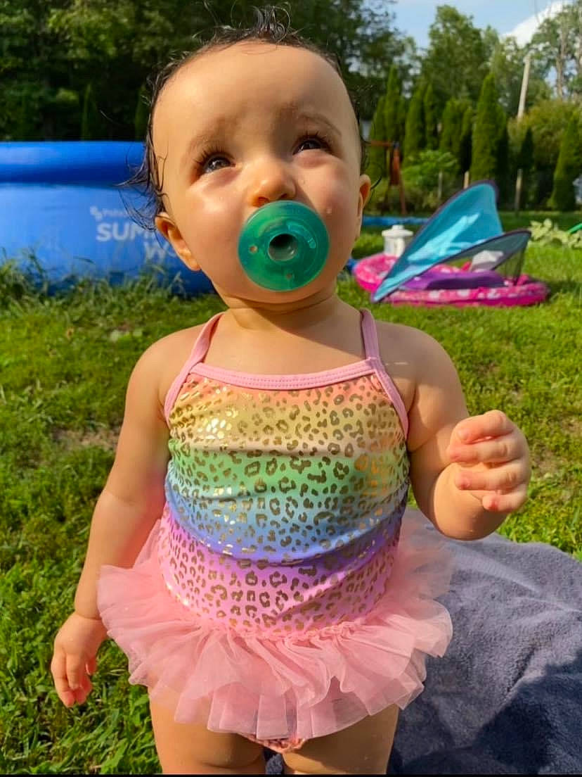 Leilanni is registered to the contest to win money with this photo: baby, baby_toddler_clothing, blue, child, fun, garden, grass, green, happy, leisure, liquid_bubble, magenta, people_in_nature, person, pink, plant, recreation, sky, summer, toddler