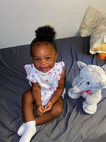 Legacy joined the competition — help win amazing prizes! arm, baby, baby_toddler_clothing, child, comfort, couch, elbow, happy, head, human_body, joy, linens, person, room, sitting, sleeve, smile, t_shirt, teddy_bear, textile