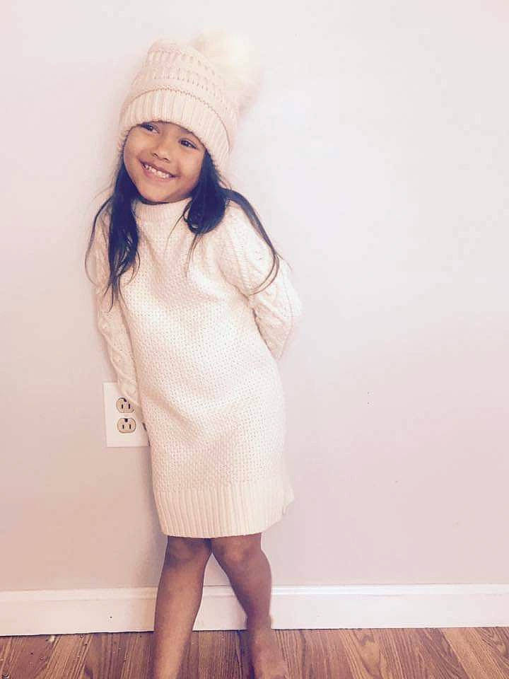 Kiana joined the competition — help win amazing prizes! beanie, beauty, child, child_model, clothing, dress, face, fashion, footwear, headgear, joy, knee, lip, outerwear, person, photography, skin, smile, standing, toddler